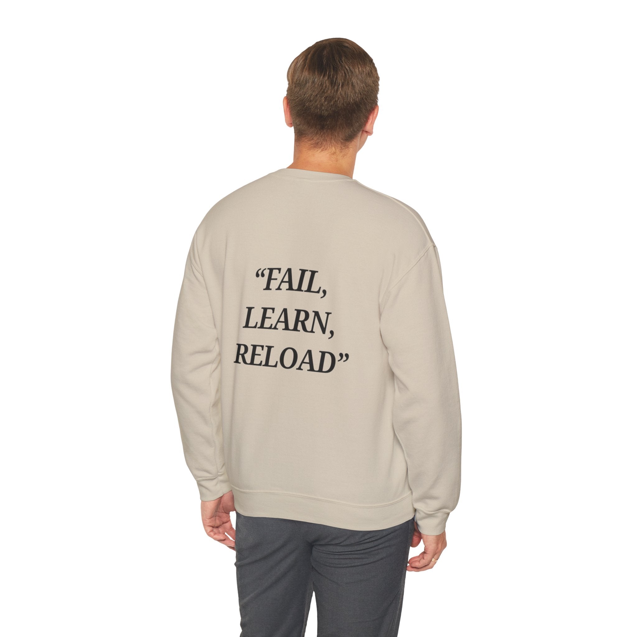 Man wearing a beige sweatshirt with 'FAIL, LEARN, RELOAD' text on the back against a white background